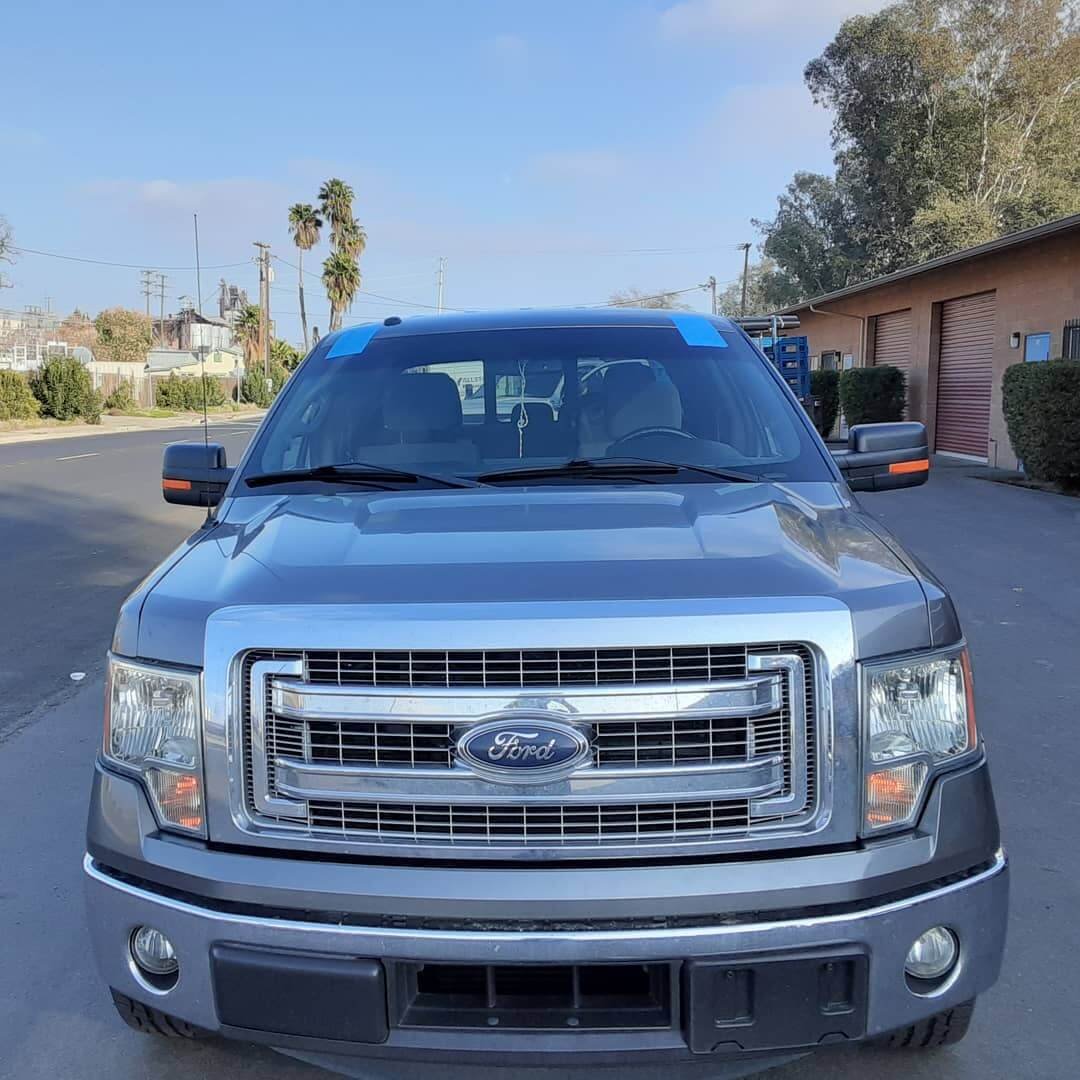 Ford Gray truck getting glass replacement at tint Plus Auto Glass in Hanford
